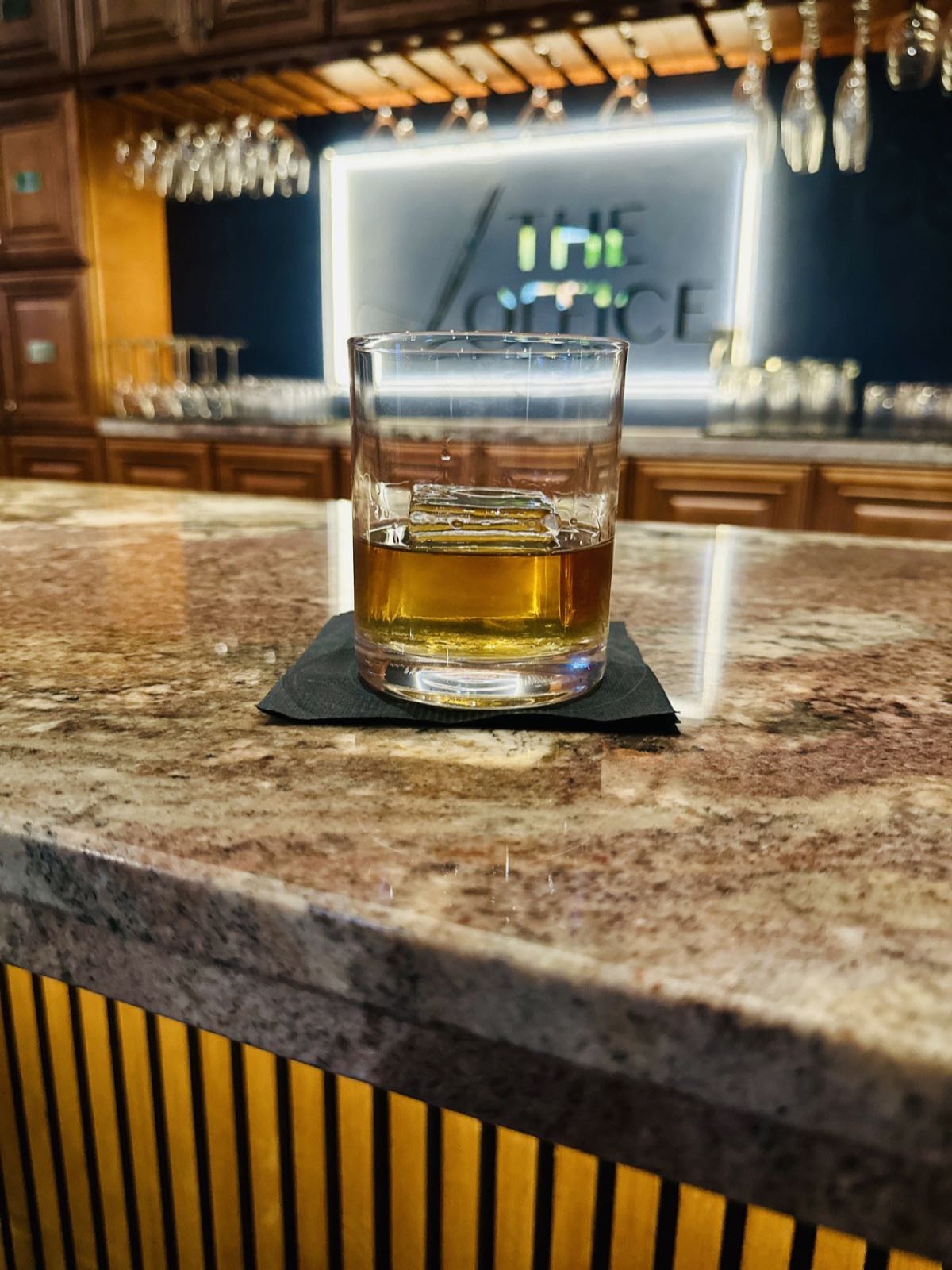 A pour of a member’s own bourbon on the bar